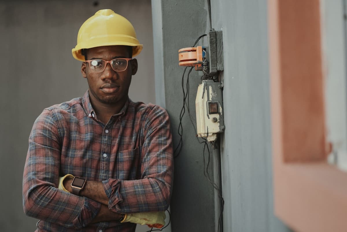 Electrician working on commercial electrical panel wiring