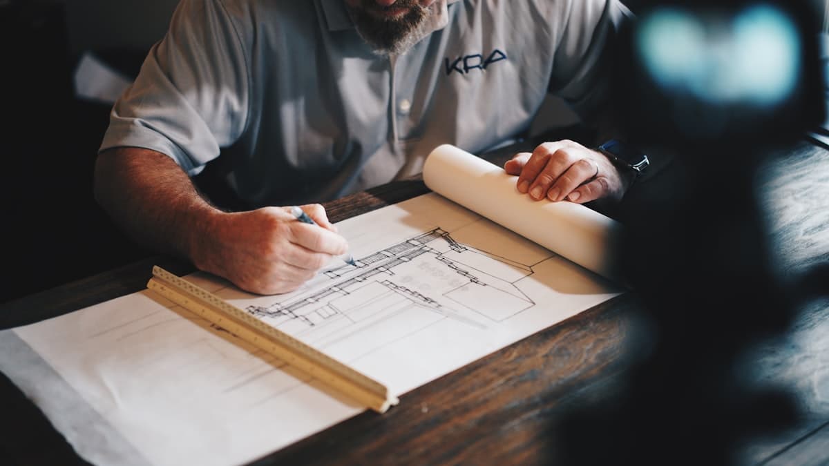 Plumber working on commercial piping at a construction site
